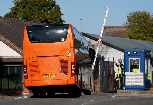 A bus carrying a group of people thought to be migrants arrives at the Manston processing centre