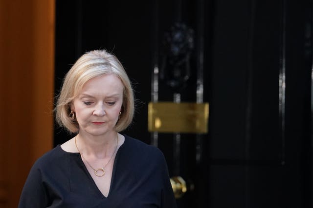 Prime Minister Liz Truss walks from the door of 10 Downing Street to read a statement following the announcement of the death of the Queen Elizabeth