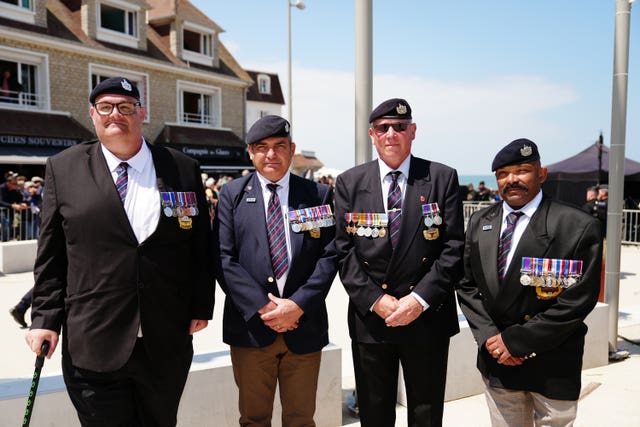 Veterans of the Gloucestershire Regiment, Stephen Hall, Simon Allen, Paul Haywood and Julian Heal, who met and spoke with the Prince of Wales during his visit to Arromanches