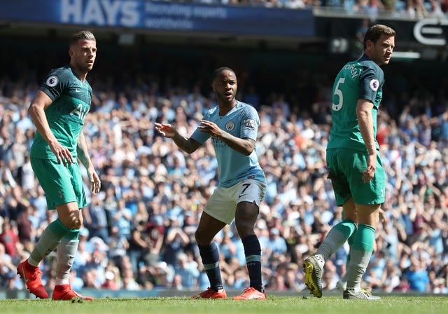 Raheem Sterling, centre, reacts after seeing a shot saved by Paulo Gazzaniga, not pictured