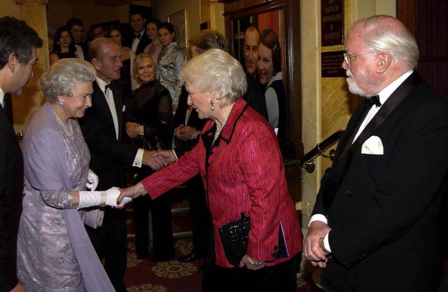 The Queen met Katie Boyle whose husband Peter was the first producer of The Mousetrap at the 50th anniversary of the world’s longest-running play, in 2002 (PA)