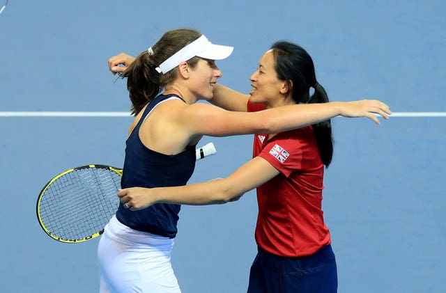 Johanna Konta is congratulated by Great Britain captain Anne Ketheovong after beating Zarina Diyas