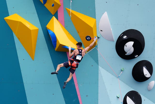 Toby Roberts makes a move during his lead climb 