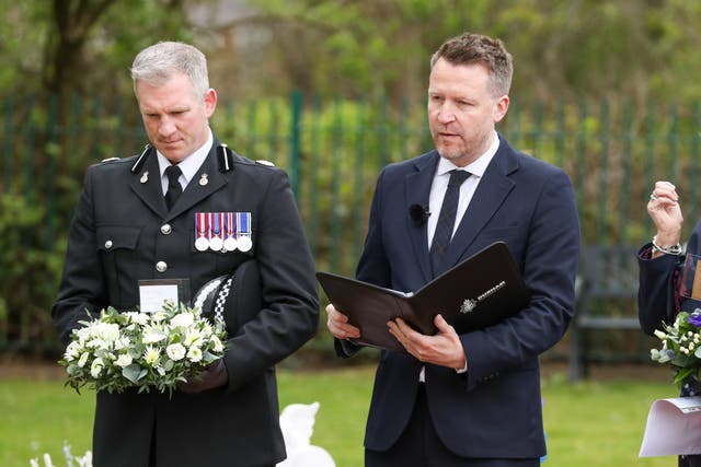 Detective Chief Inspector Mel Sutherland (right) delivering a tribute during the funeral service
