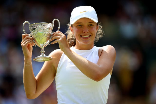 Iga Swiatek with the girls' singles trophy at Wimbledon two years ago