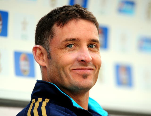 Mike Hussey turns and smiles at the camera during a T20I between Australia and England in 2010.