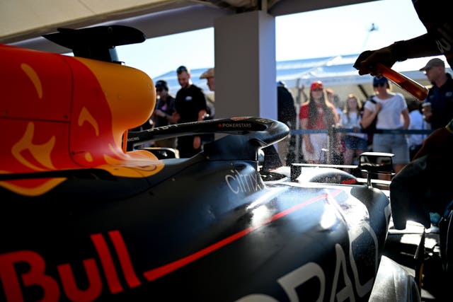 Sun gleams off a Red Bull racing car as it is prepared at the Goodwood Festival of Speed in West Sussex 