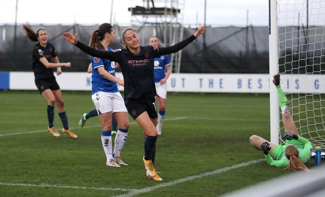 Janine Beckie celebrates her goal