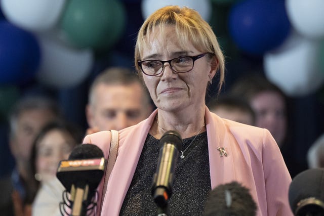 Sandie Peggie speaking into microphones