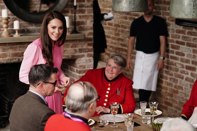 The Princess of Wales speaks to Chelsea Pensioners after meeting pupils