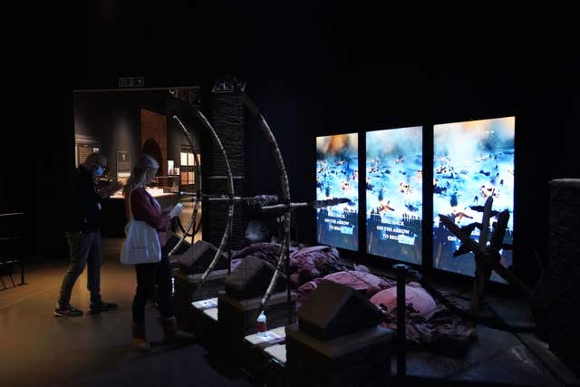 Visitors interact with a display during a preview day of the Game Of Thrones Studio Tour at Linen Mill Studios in Banbridge, Northern Ireland