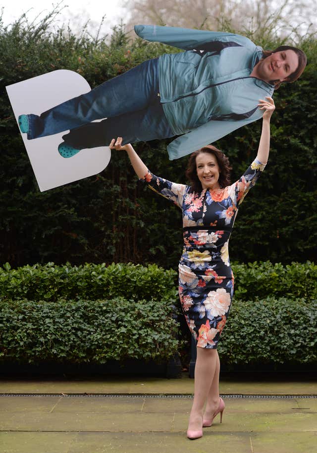 Laura Cosbie holds a cardboard cutout of herself before she lost weight (Kirsty O’Connor/PA)