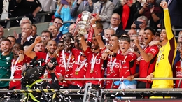 Manchester United’s Bruno Fernandes lifts the FA Cup following victory over City (John Walton/PA)