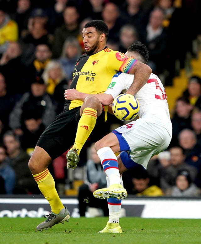 Watford's Troy Deeney got caught up with Crystal Palace's Martin Kelly during the 0-0 draw which was the Hornets' first home match since sacking Quique Sanchez Flores for a second time
