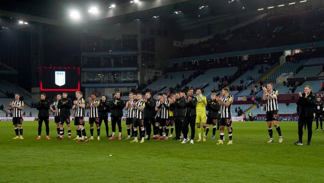 Newcastle applaud their fans after victory at Villa Park
