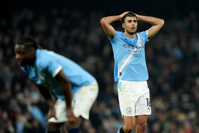 Manchester City’s Rodri (right) and Jeremy Doku (left) react at the final whistle after the draw against Nottingham Forest