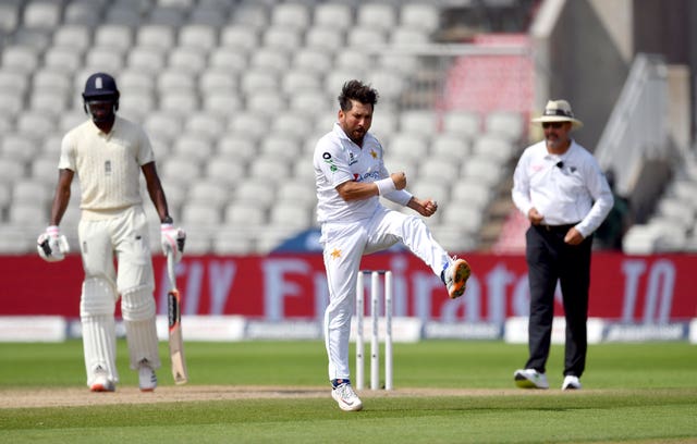 Yasir Shah celebrates taking the wicket of England's Chris Woakes