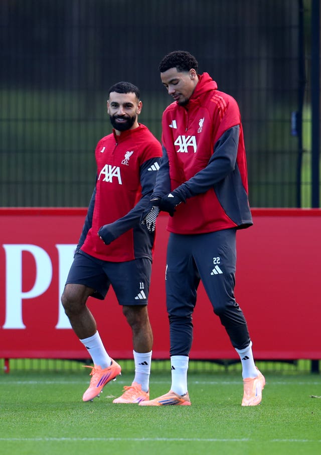 Mohamed Salah (right) and Hugo Ekitike chatted before Monday's training session