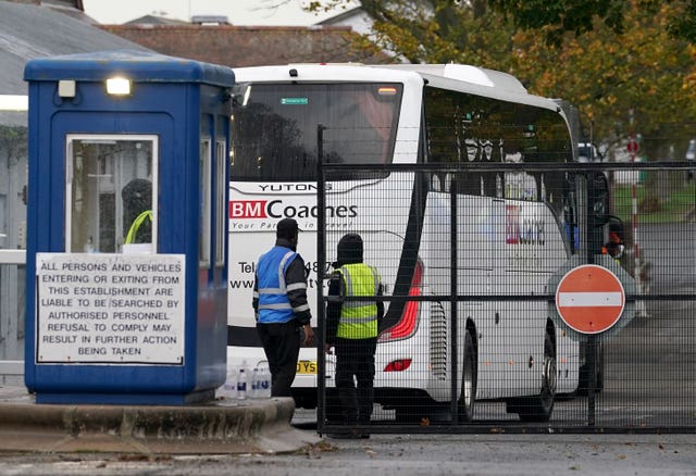 A coach arrives at the Manston immigration short-term holding facility located at the former Defence Fire Training and Development Centre in Thanet, Kent