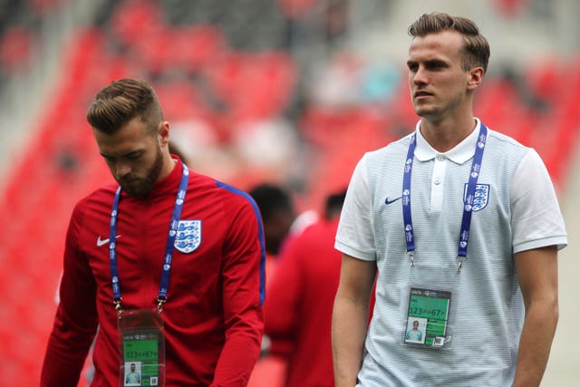 Holding (right) has represented England at Under-21 level