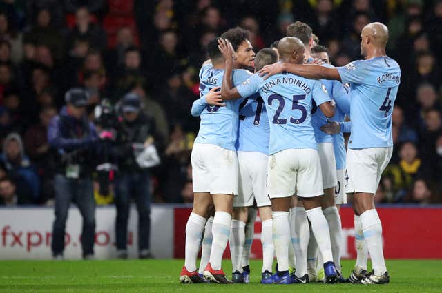 Manchester City remained unbeaten after holding on at Watford