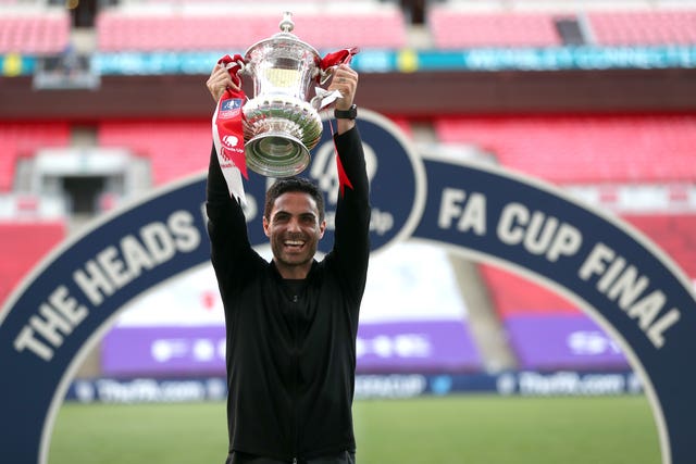 Arsenal manager Mikel Arteta celebrates with the FA Cup trophy