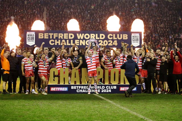 Wigan Warriors’ Liam Farrell lifts the World Club Challenge trophy following a 16-12 victory over Penrith Panthers at the DW Stadium