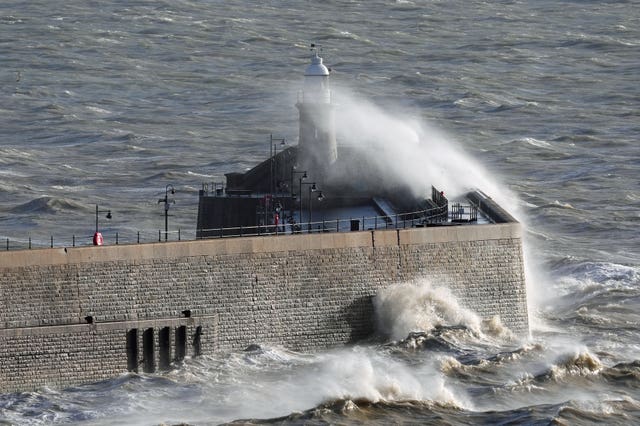 Waves crash over the seal wall at Folkestone