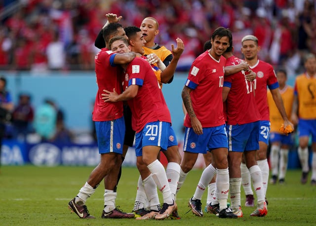 Costa Rica celebrate their win against Group E rivals Japan