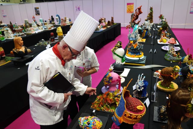 Judges examining cakes