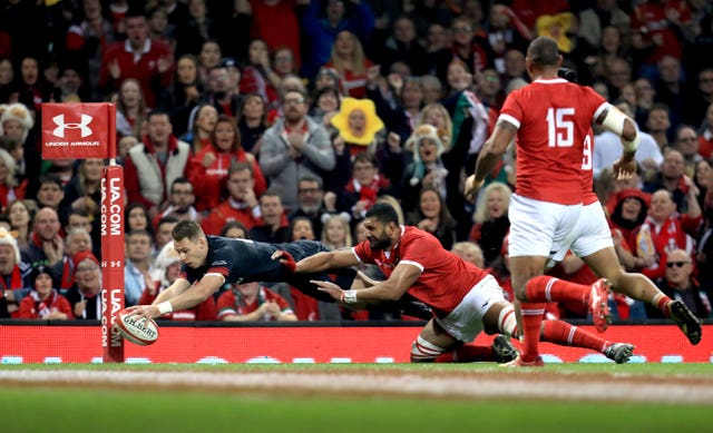 Liam Williams, left, scores on his 50th appearance for Wales (