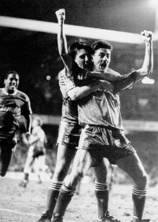 Liverpool's Ian Rush, right, celebrates his goal with Peter Beardsley