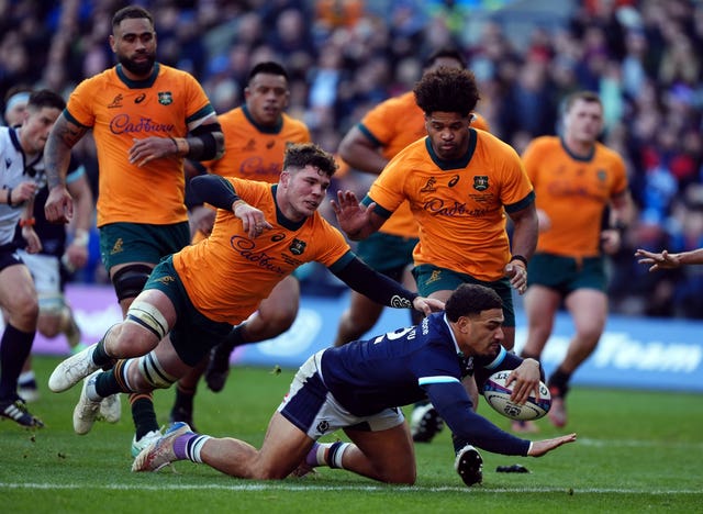 Sione Tuipulotu breaks clear to score a try against Australia