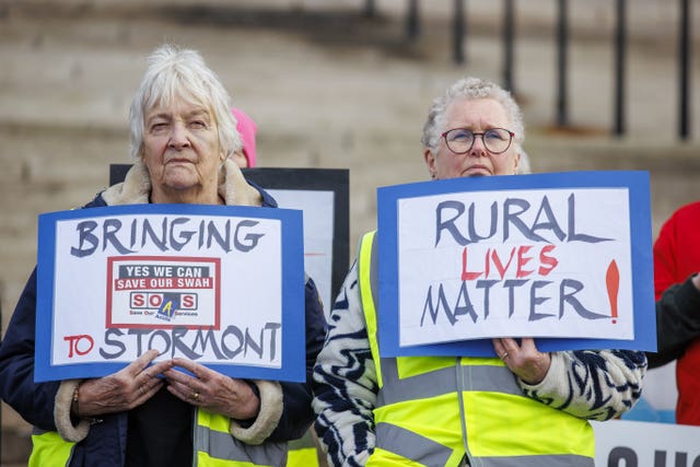 Supporters of community group SOAS (Save Our Acutes Services) from Fermanagh at Parliament Buildings at Stormont in Belfast