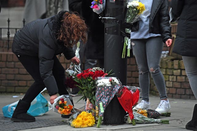 Floral tributes were left at the scene (Kirsty O'Connor/PA)