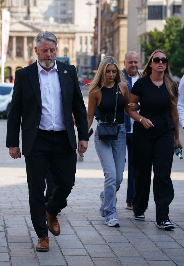 The father of Ms Edwards, Tim Edwards, arrives at court with family members earlier this month