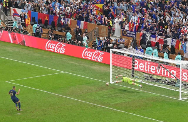 Mbappe scores his first penalty in Sunday's clash with Argentina (Adam Davy/PA). 