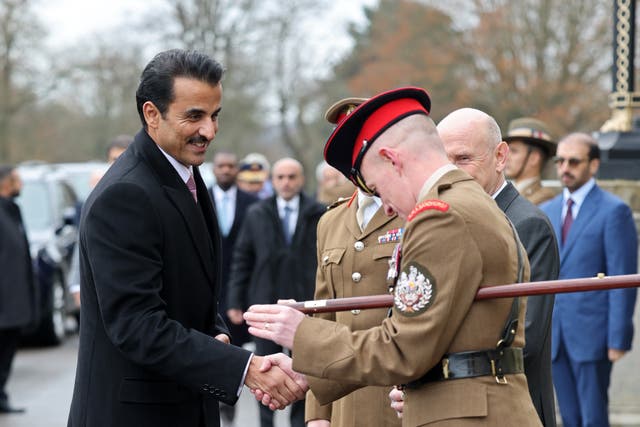 The Emir of Qatar shakes hand with the Academy Sergeant Major at the Royal Military Academy Sandhurst