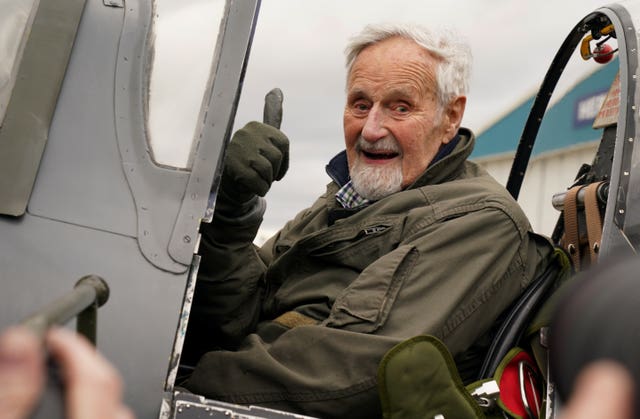 Jack giving a thumbs up in the Spitfire