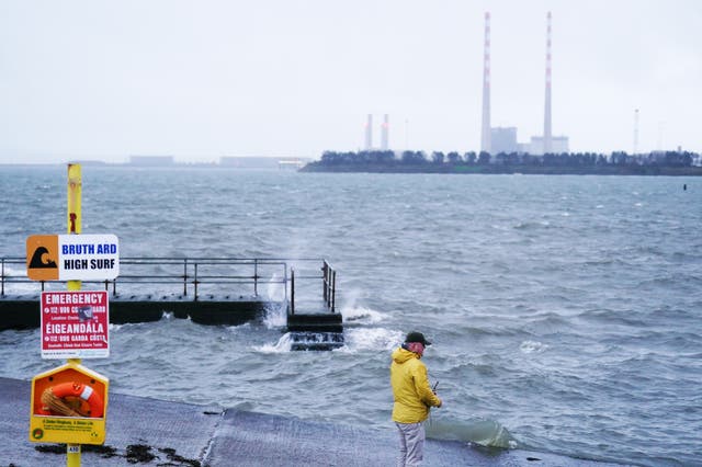 A person standing on a slipway 