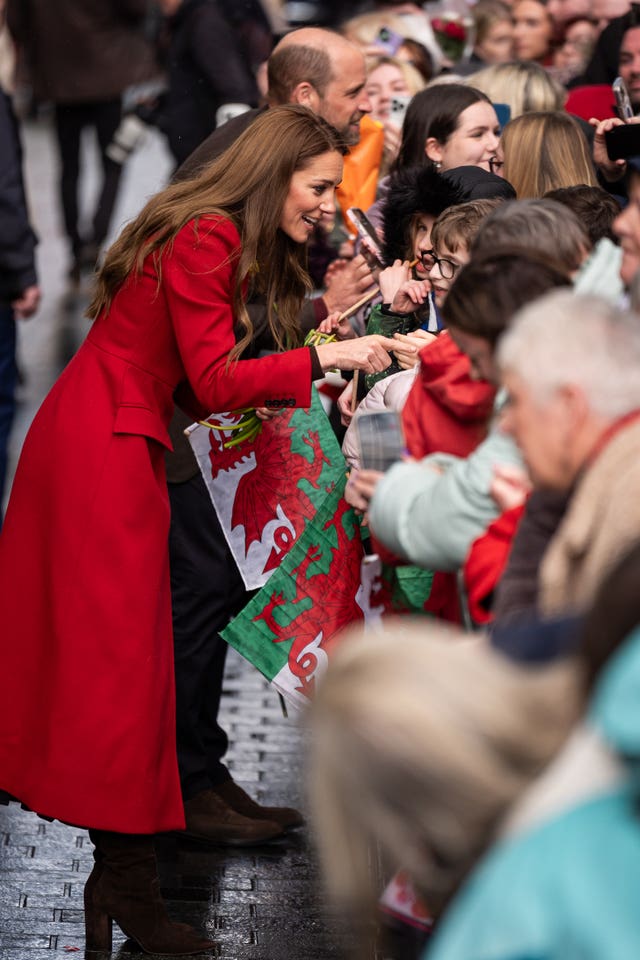 The Prince and Princess of Wales greet well-wishers during a visit to Pontypridd Market 