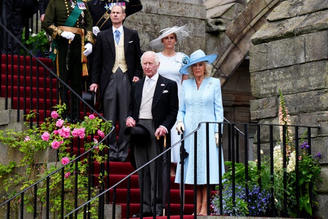 The King and Queen with the Duke and Duchess of Edinburgh coming down stairs at the garden party