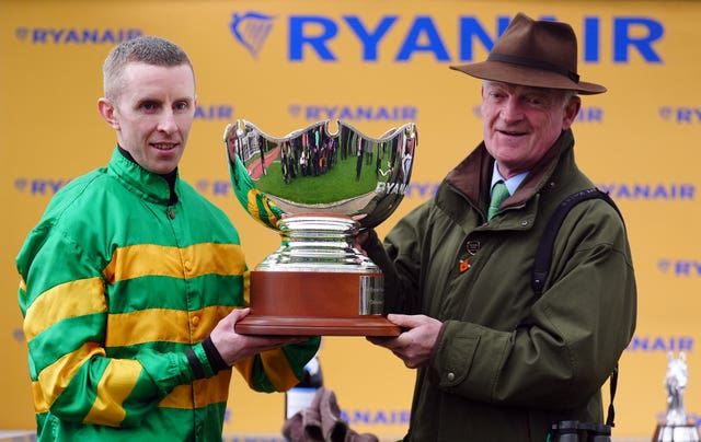 Willie Mullins and Mark Walsh with the Ryanair Chase trophy