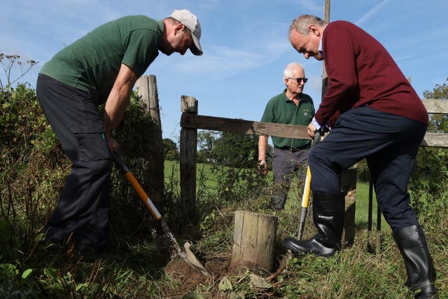 Liberal Democrat leader Sir Ed Davey digs with The Monday Group volunteers in Sussex 