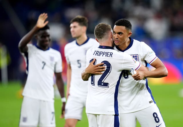England’s Kieran Trippier hugs team-mate Trent Alexander-Arnold
