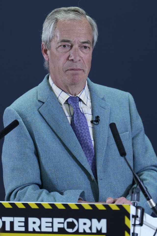 Head and shoulders photo of Nigel Farage standing at a Reform lectern