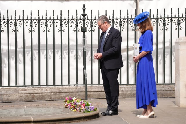 Prime Minister Sir Keir Starmer and his wife Lady Victoria Starmer lay flowers at the Innocent Victims’ Memorial, following a Service of Thanksgiving at Westminster Abbey in London on the 80th anniversary of VE Day