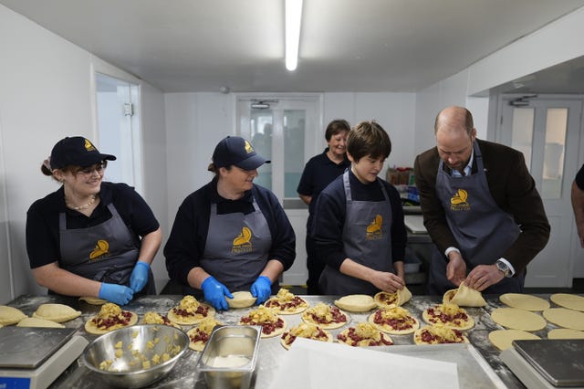 The Prince of Wales, known as the Duke of Cornwall while in Cornwall, tries his hand at crimping pasties during his visit to the Gear Farm Pasty Company, a family-run farm known for producing traditional Cornish pasties in St Martin, Helston, as he visits Cornwall for St Piran’s Day 