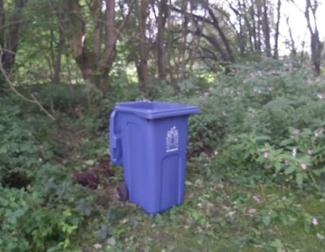 The blue wheelie bin found in the cemetery