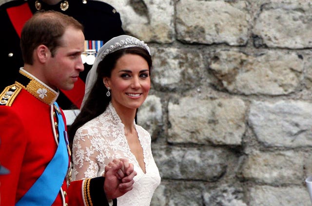 William and Kate leave Westminster Abbey holding hands as newlyweds after their marriage ceremony in 2011